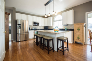 a kitchen with wooden floor